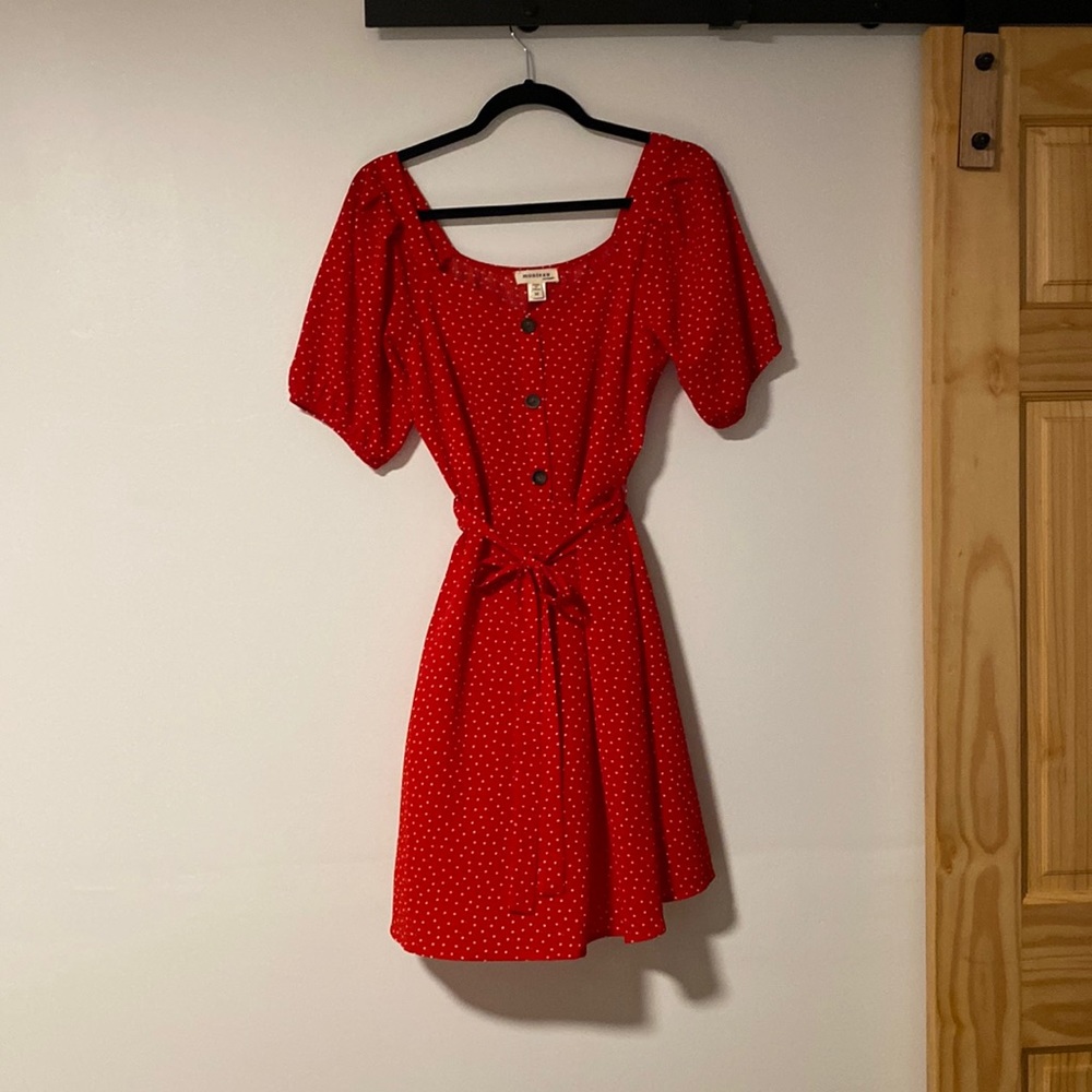 Red and white polka dot puff sleeve dress.